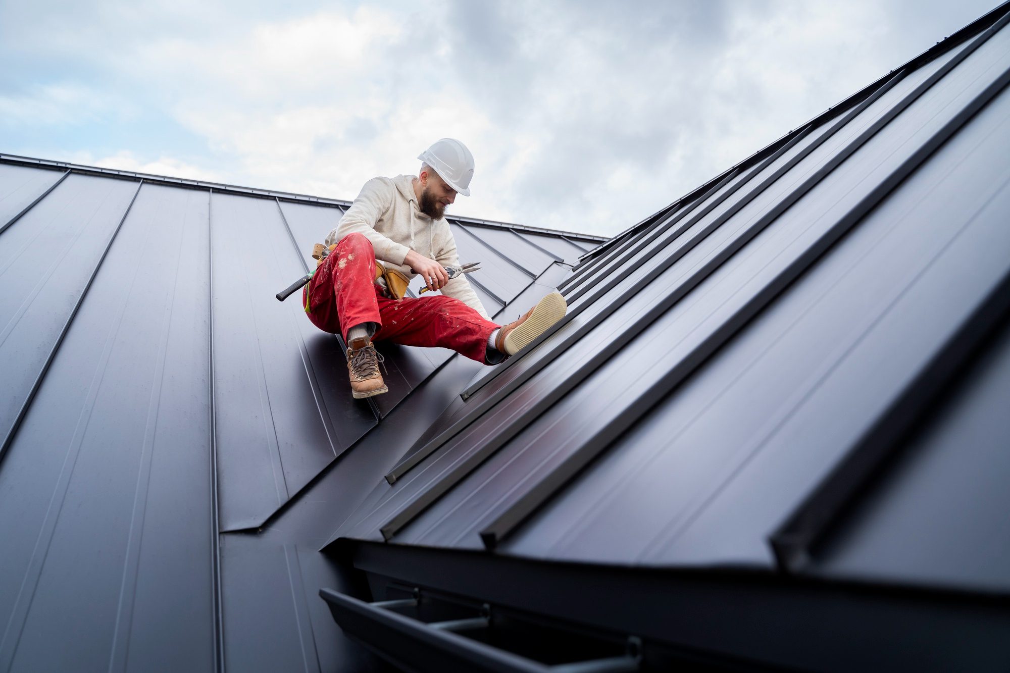 Full shot man working on roof Full shot man working on roof<br />